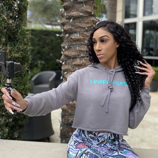 Dress Code 187 Unapologetic Cropped Hoodie in a color storm grey with teal text. 